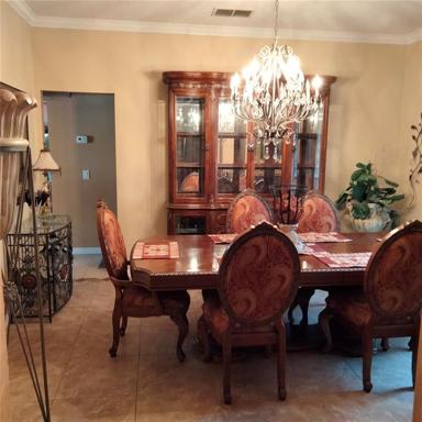 View of the formal dining room on the right after entering the home
