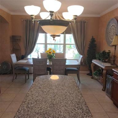 Looking at the Dinette area and the pool from the kitchen 