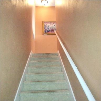 Stairs to the second floor from the foyer
