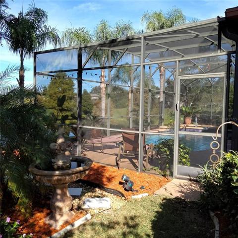 Left side Side view of screened-in pool and spa