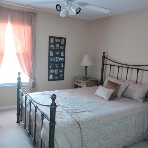 The third bedroom has a nice view of the pool and the pond