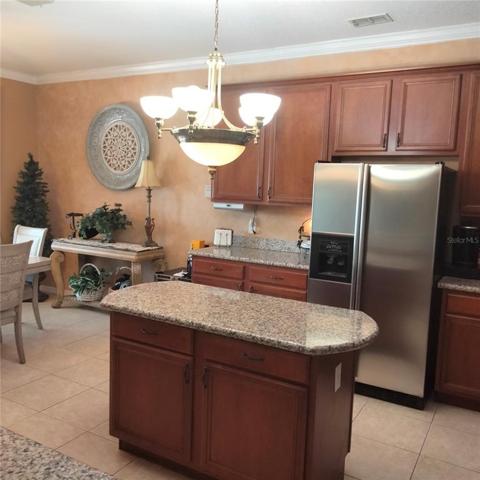 Kitchen with a center island for food preparation and serving