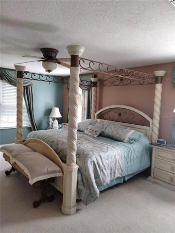 The large master bedroom has a large walk-in closet and a second are that could be a closet, nursery, office, or sitting room
