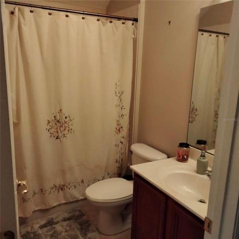 The fifth bedroom bathroom with a tub and shower combination