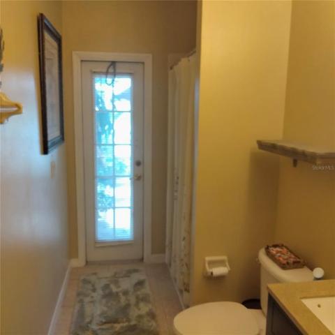 First floor pool bathroom with a large shower, next to the first floor bedroom