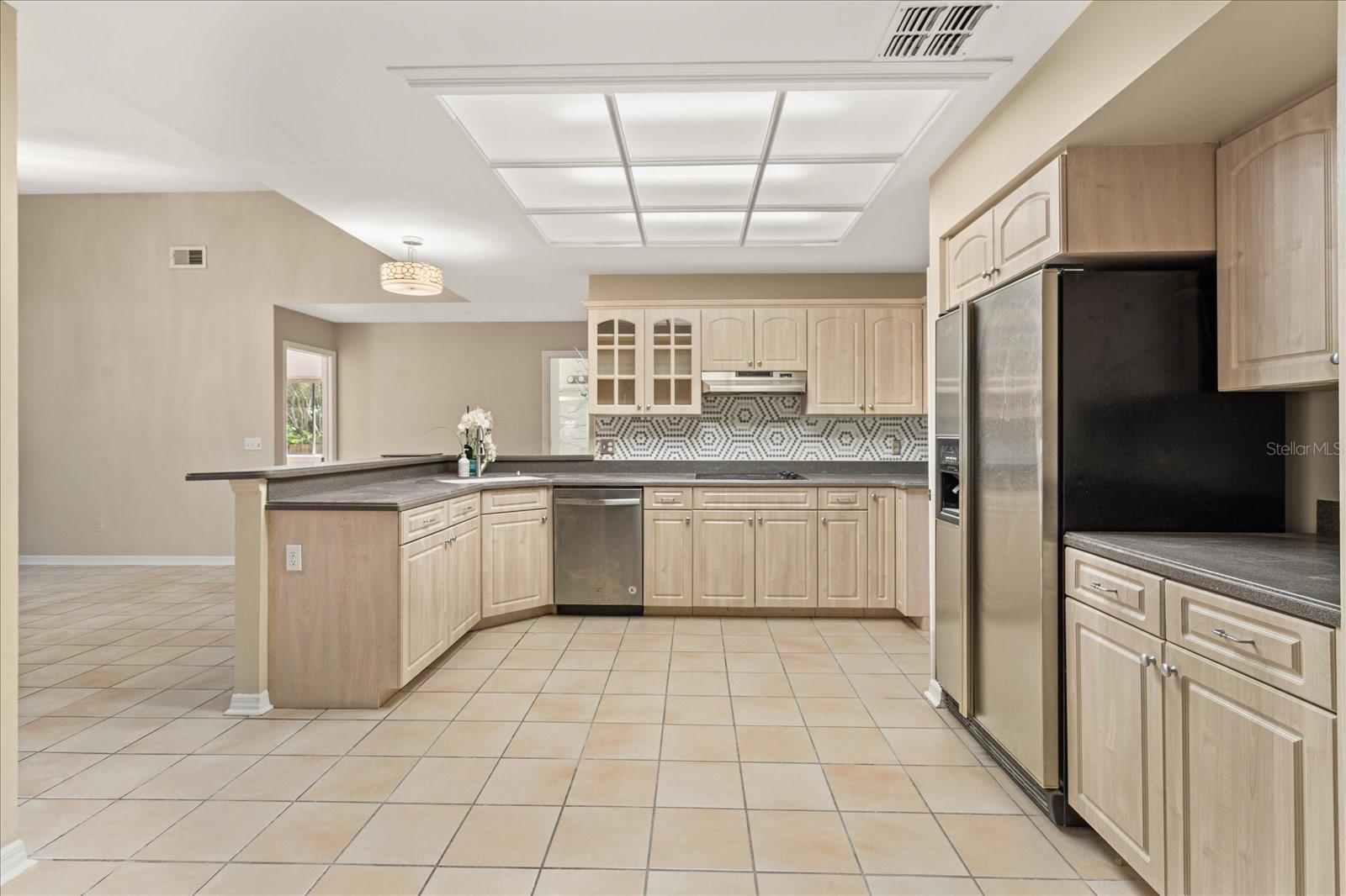 Kitchen overlooks Family Room and views of secondary bedrooms