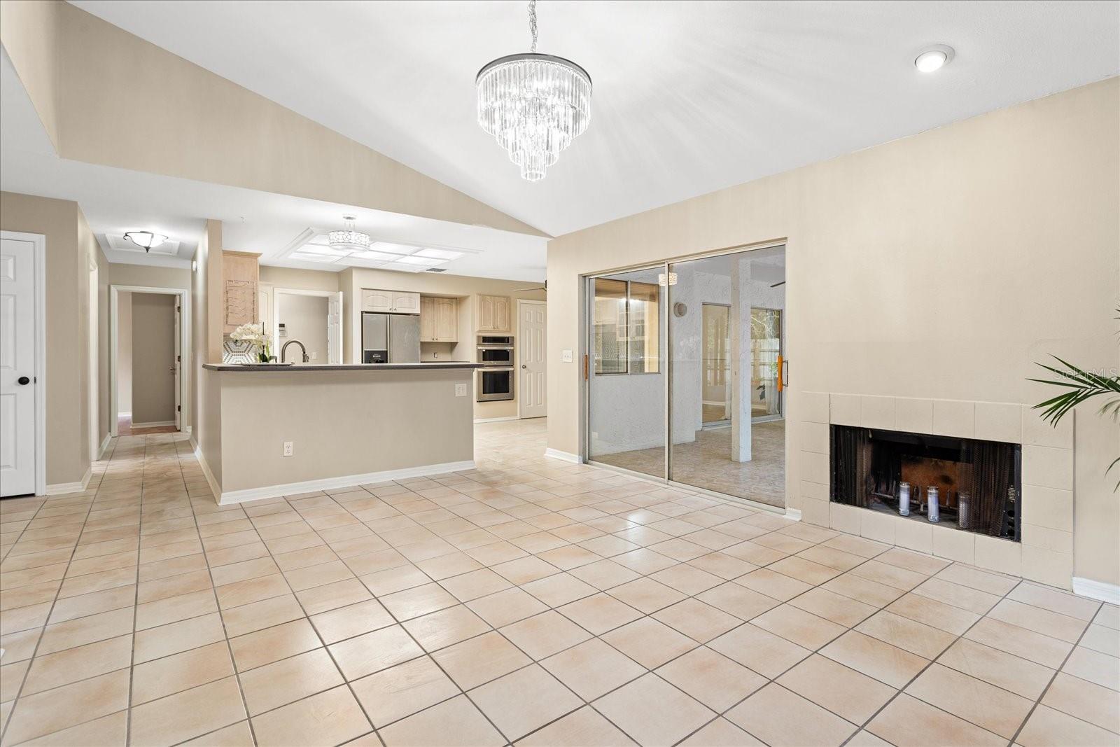 Family room view of kitchen with breakfast bar
