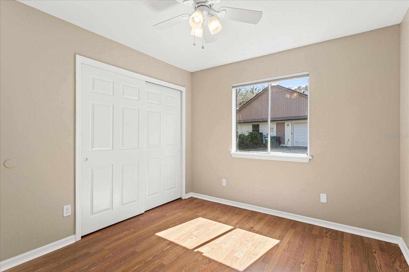 Secondary bedroom three with spacious closets and low maintence flooring