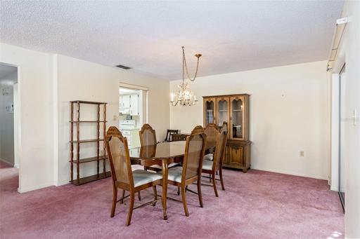 Formal dining area just off the kitchen and Florida room .
