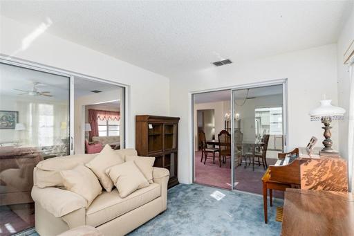 Florida room air conditioned , could be utilized as an office or bonus room , by removing the sliding doors.