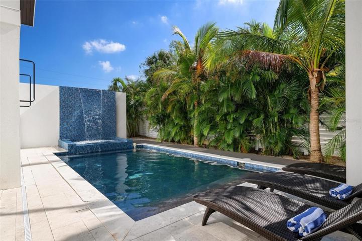 Heated pool and spa with waterfall feature