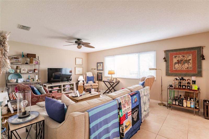 Light, bright living room with view of back yard