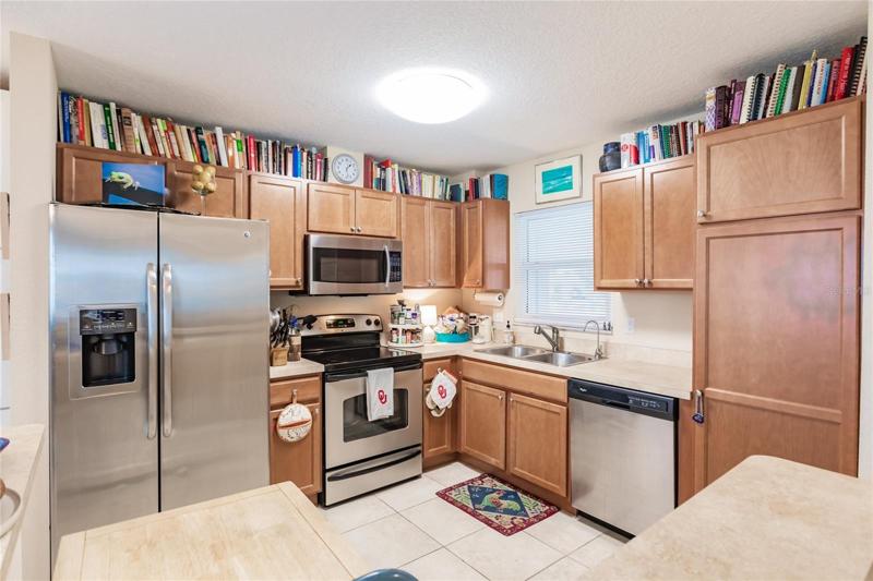 Open kitchen with newer cabinets, nice pantry cabinet