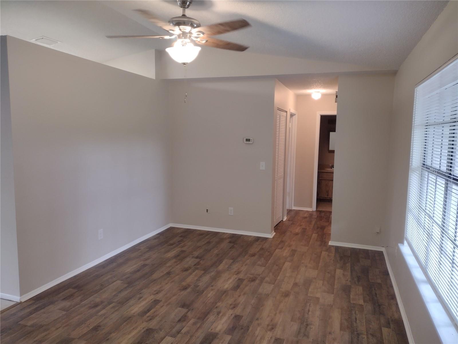 Living Room with new Laminate Floors and Ceiling Fan
