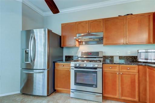 Gas Stove, Wood Cabinets, Tile Floor