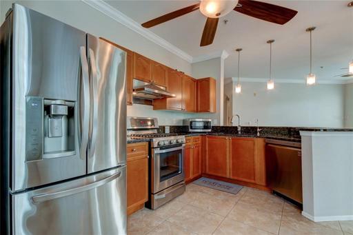 Gas Stove, Wood Cabinets, Tile Floor