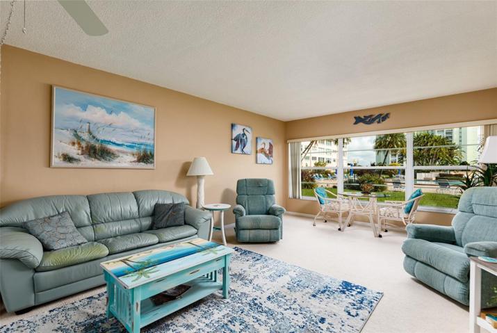 Comfortable area with tropical views. Colored lights in pool at night.