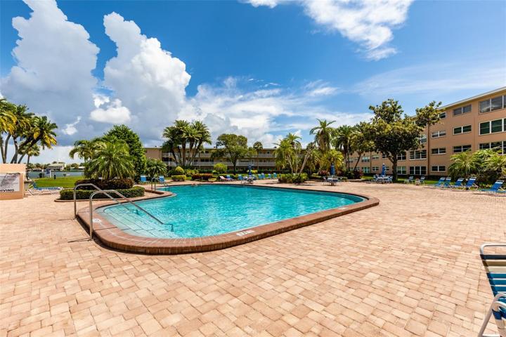 Heated pool & tropical landscaping.