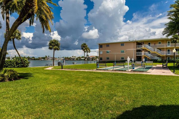 Shuffleboard & grilling area by pool on Boca Ciega Bay.