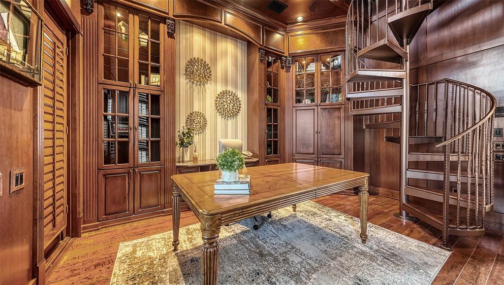Office with spiral staircase to library and loft