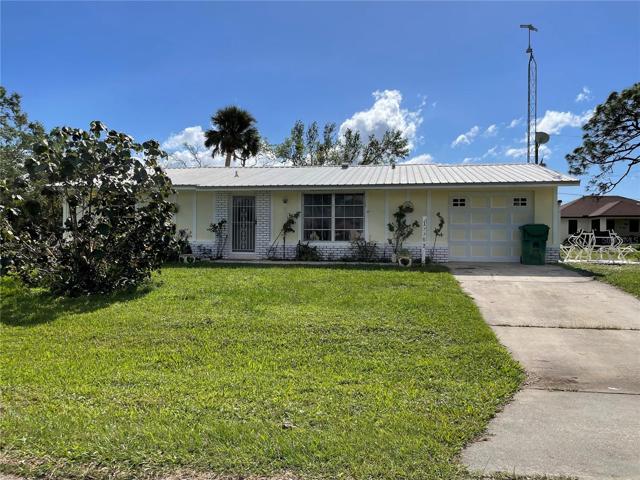 Front of house on an oversized corner lot with firehydrant on corner