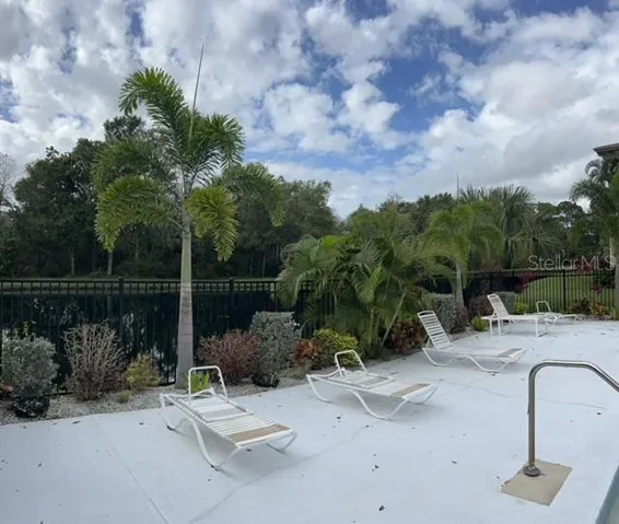 Pool sits next to a Pond