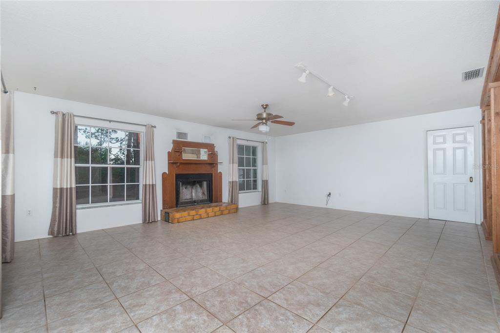 Second view of the formal dining room with load baring wall between the family room.