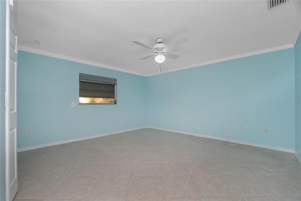 The family room features a wood burning fireplace and double doors to the enclosed lanai.