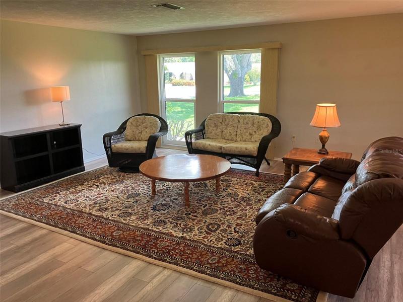 Lots of floor to ceiling windows.  Laminate flooring