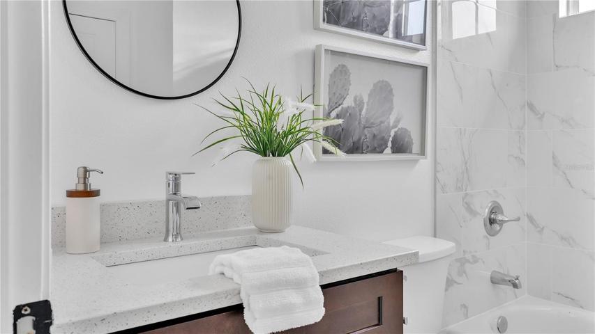 3rd Bathroom with quartz countertop- bathtub and shower