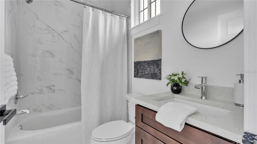 Guest Bathroom with a tub and shower