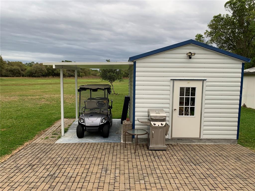 New 12'x12' shed with washer/dryer and golf cart canopy. No rear neighbors. Enjoy sitting on your porch and watch the wildlife.