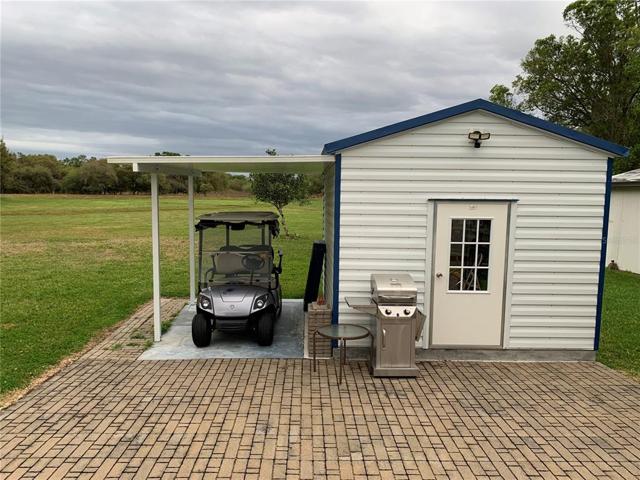 New 12'x12' shed with washer/dryer and golf cart canopy. No rear neighbors. Enjoy sitting on your porch and watch the wildlife.