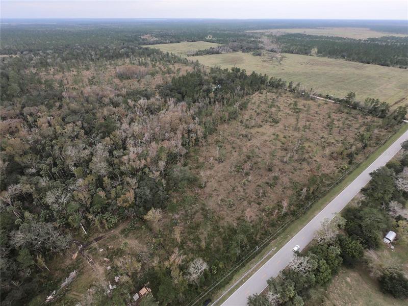 10 acres of Wooded land on paved county line road