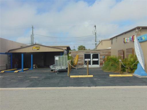 Surfer warehouse is the double door entry, left is the Weeks trailers space with paint booth in rear. Lift not included, paint booth is.