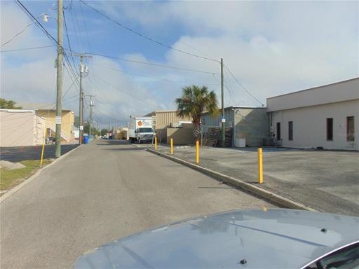 Access road with property starting on the right side at the pole with the handicap sign and continues to the end of the tan building past the truck. Access road runs between Grove and Warfield 1/2 block south of Venice ave running east and west as does Venice ave.