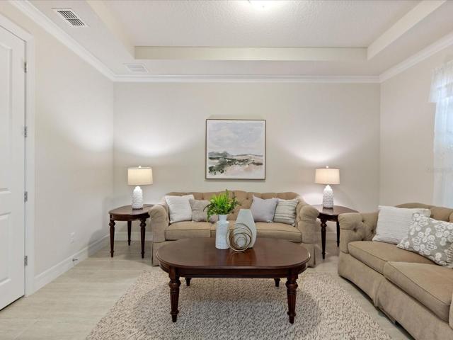 Flex space right when you walk in, can be used as a home office, formal living, or formal dining.