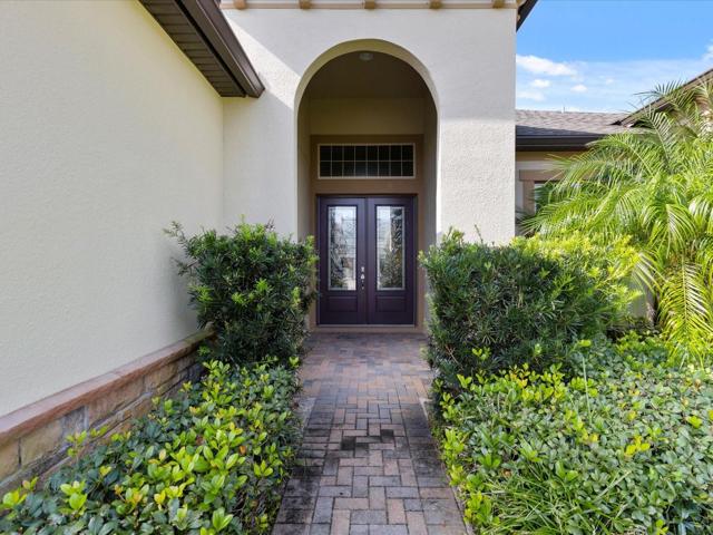Gorgeous entryway leading up to front door.