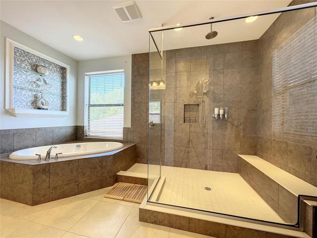 Dual shower head and built-in bench