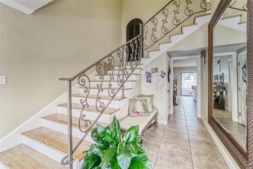 Gorgeous Wooden Staircase with wrought iron railing