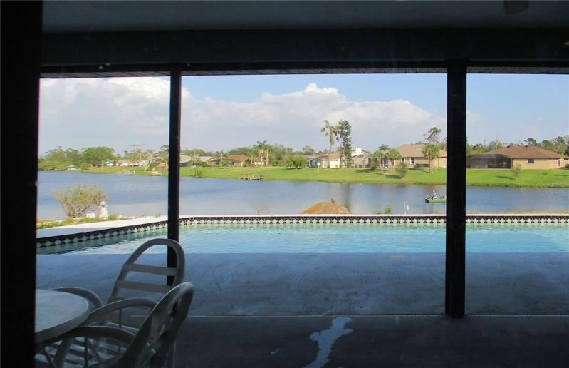 View of pool and water from lanai.