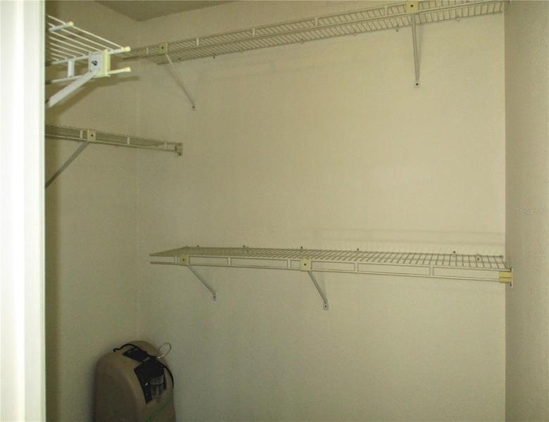 Primary bedroom walk-in closet