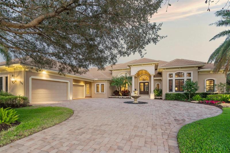 Custom John Cannon Home, surrounded by mature landscaping on an estate size lot.