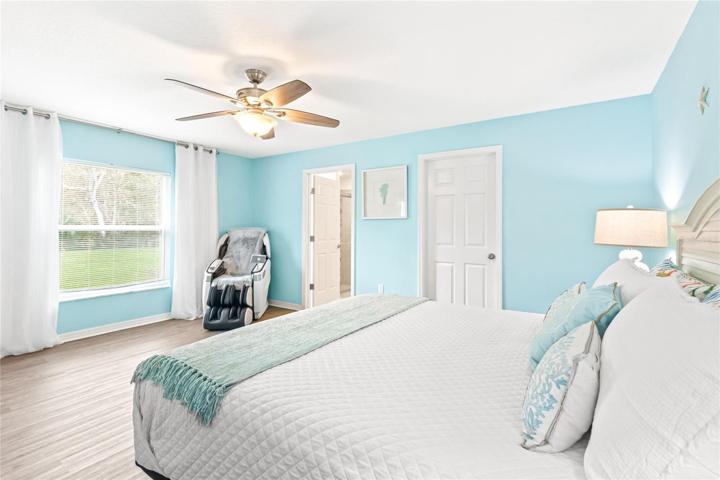 Master bedroom in main house looking outside to water.