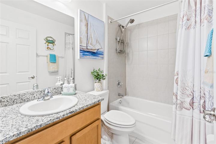 Guest bath in main house-curtain open.