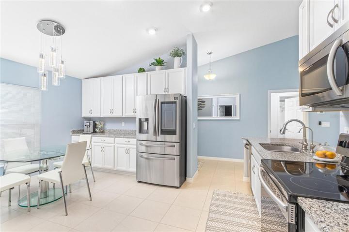 Kitchen in main house with bright and open space.