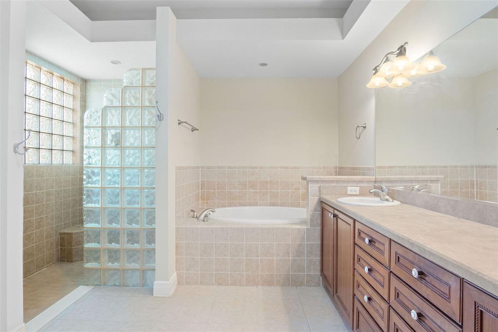 Master Bathroom With Dual Vanities, Walk-In Shower, Separate Soaker Tub And Linen Closet