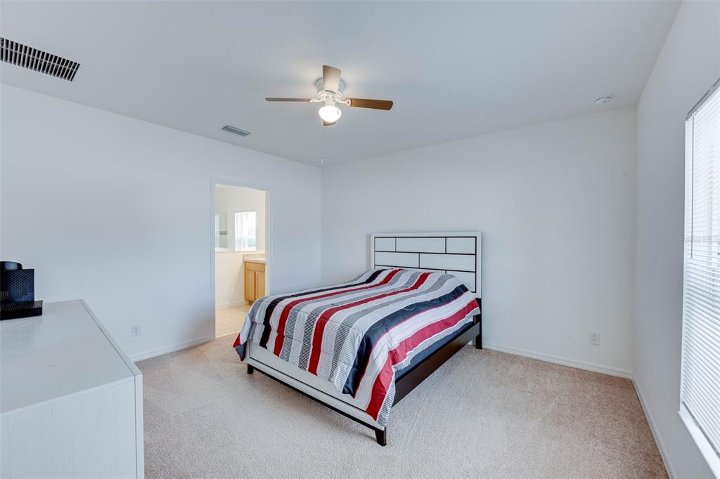 Master bedroom with view to master bath.