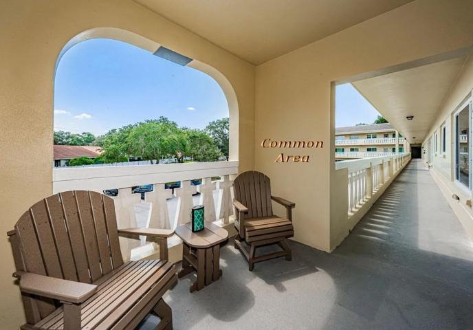 Common area by the stairwell. Elevator is in the center of the building