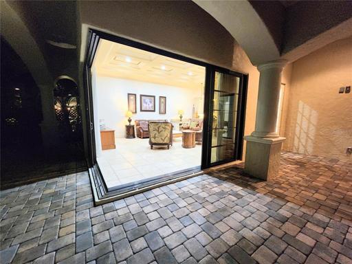 Living Room Sliding Glass Doors Open 16 Lineal Feet opens to patio
